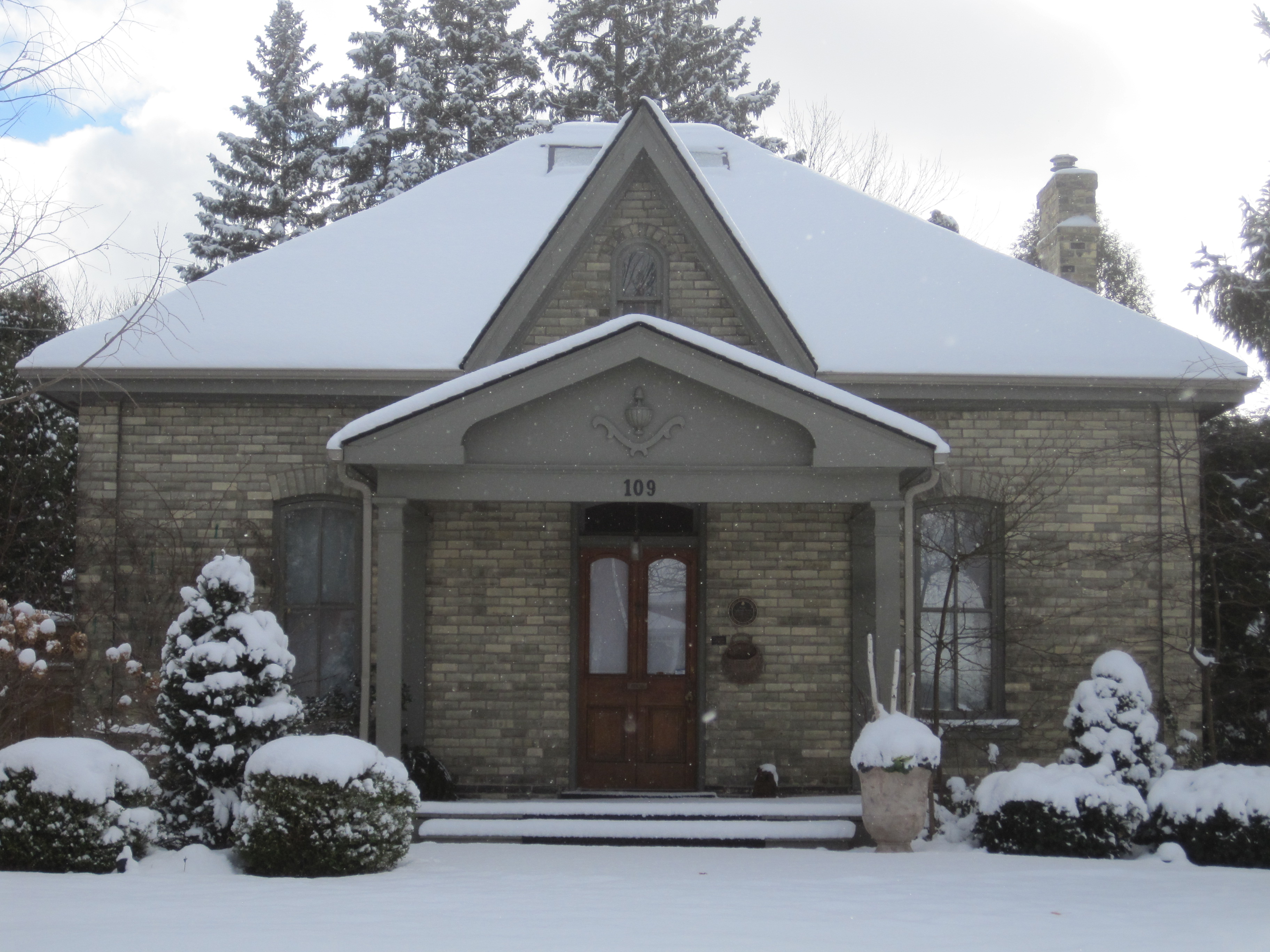 Yellow brick Gothic Revival/Ontario Cottage style house