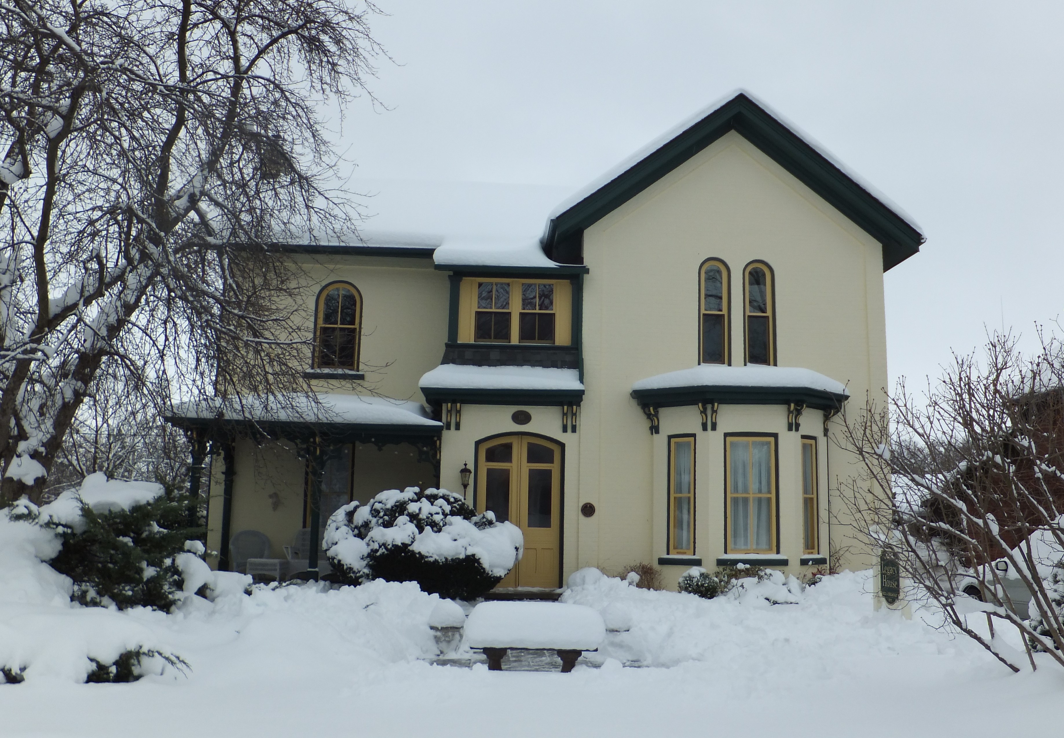 Cream painted brick Italianate style house