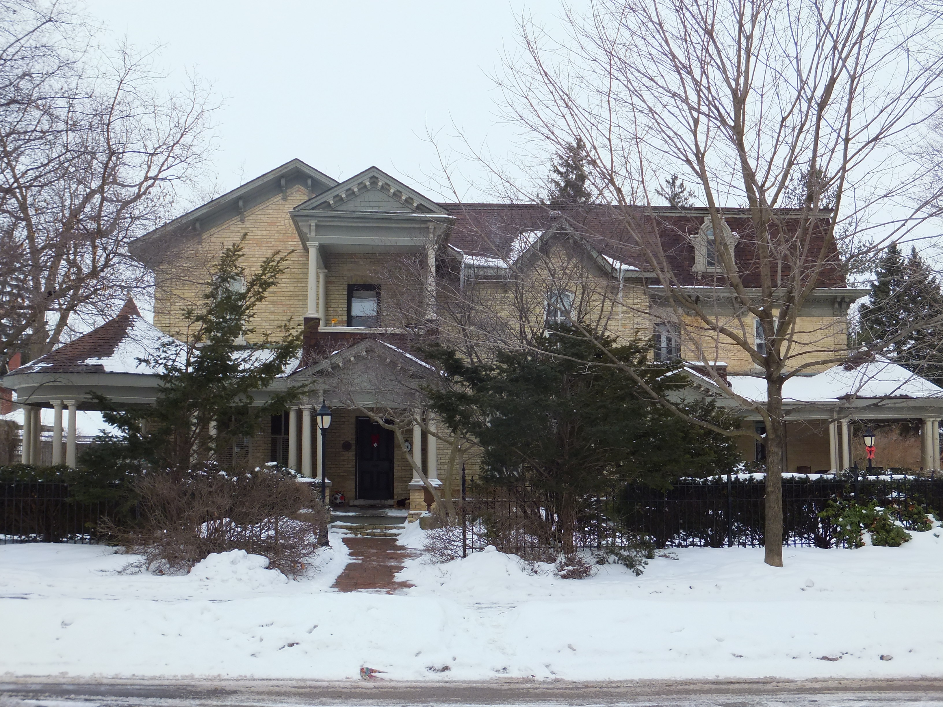 Yellow brick Italianate Second Empire style house