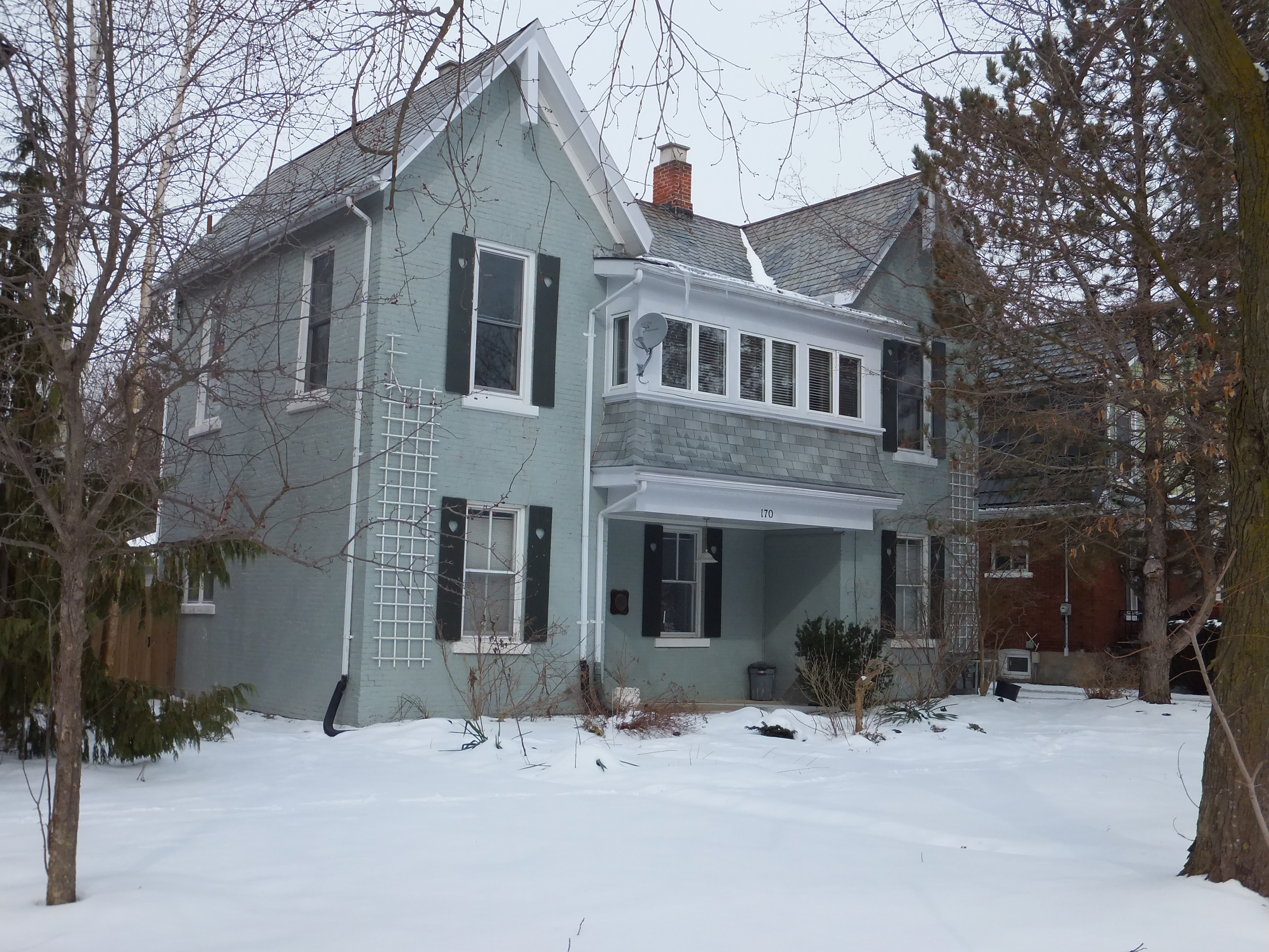 Grey painted brick Gothic Revival style house