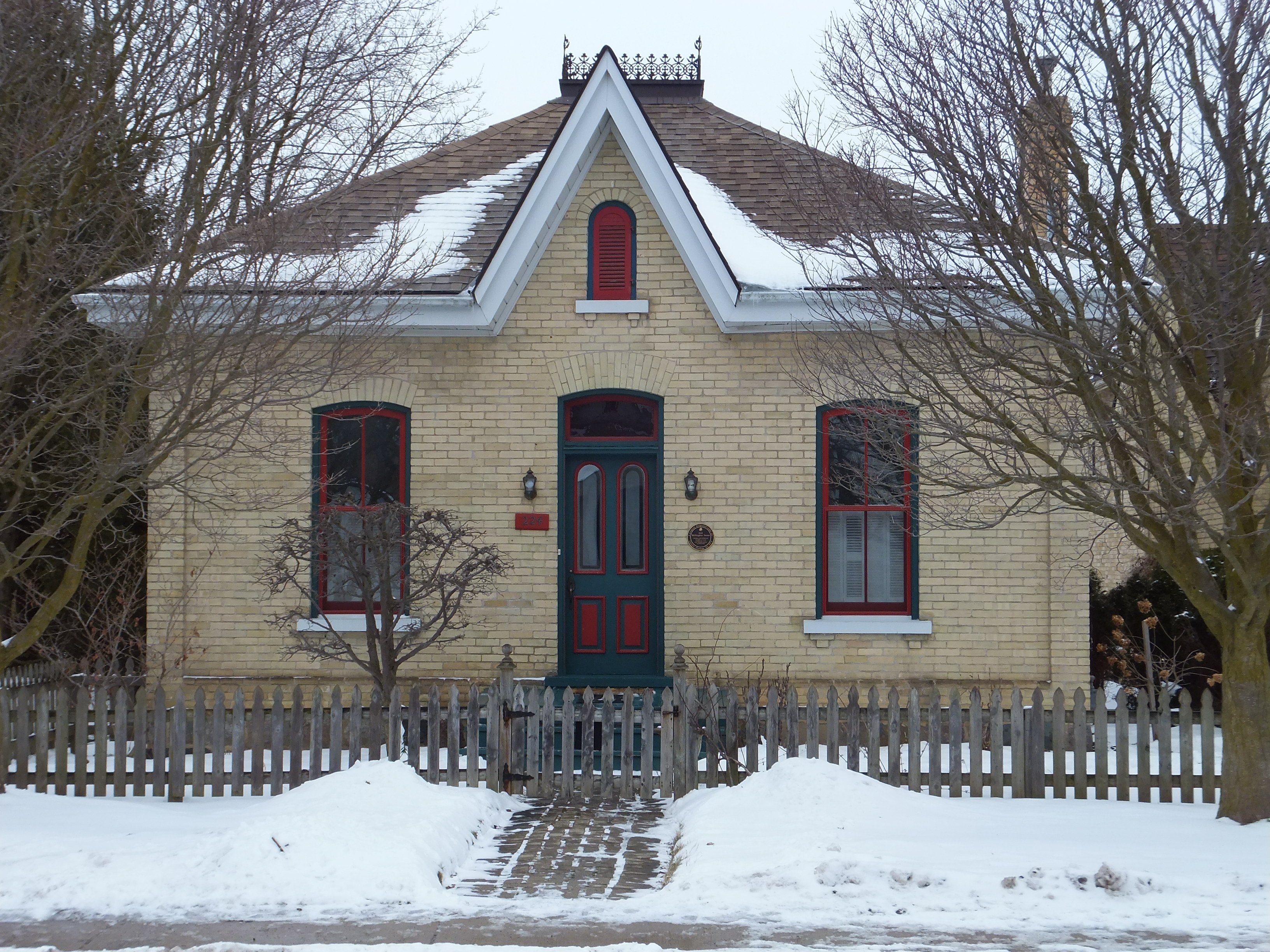 Buff brick Ontario Cottage style house