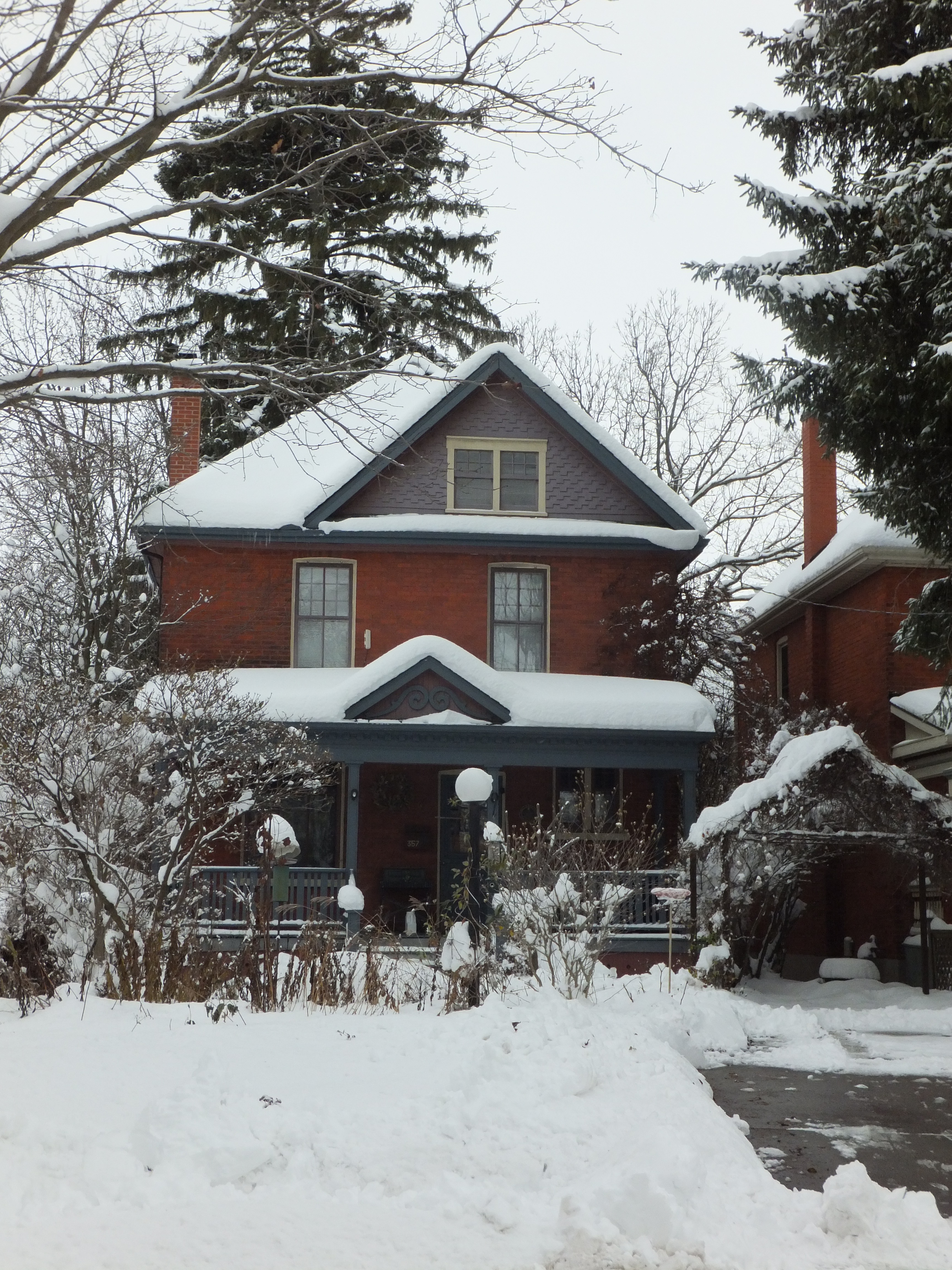 Red brick Queen Anne Box style house