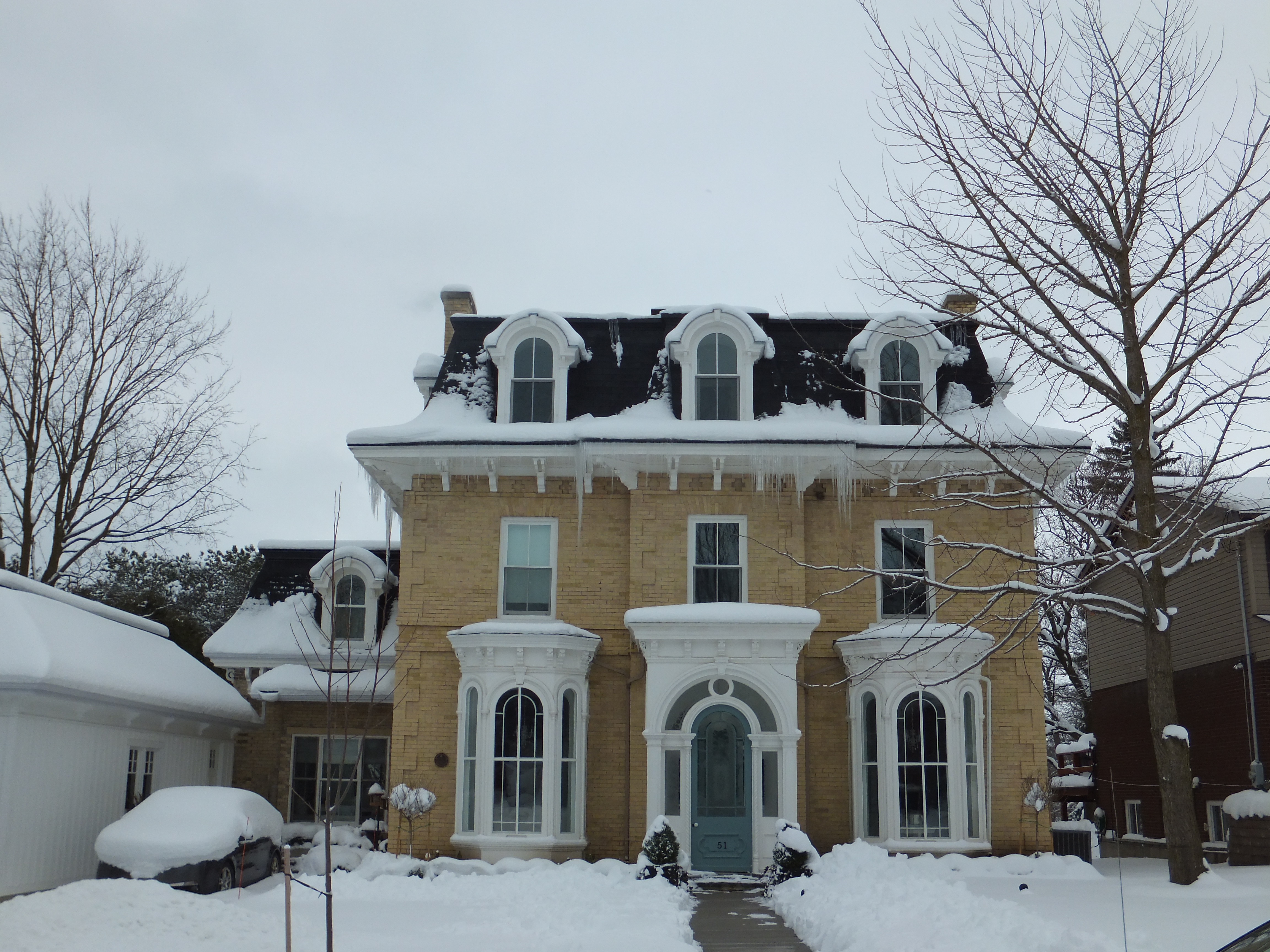 Buff brick Second Empire Italianate style house