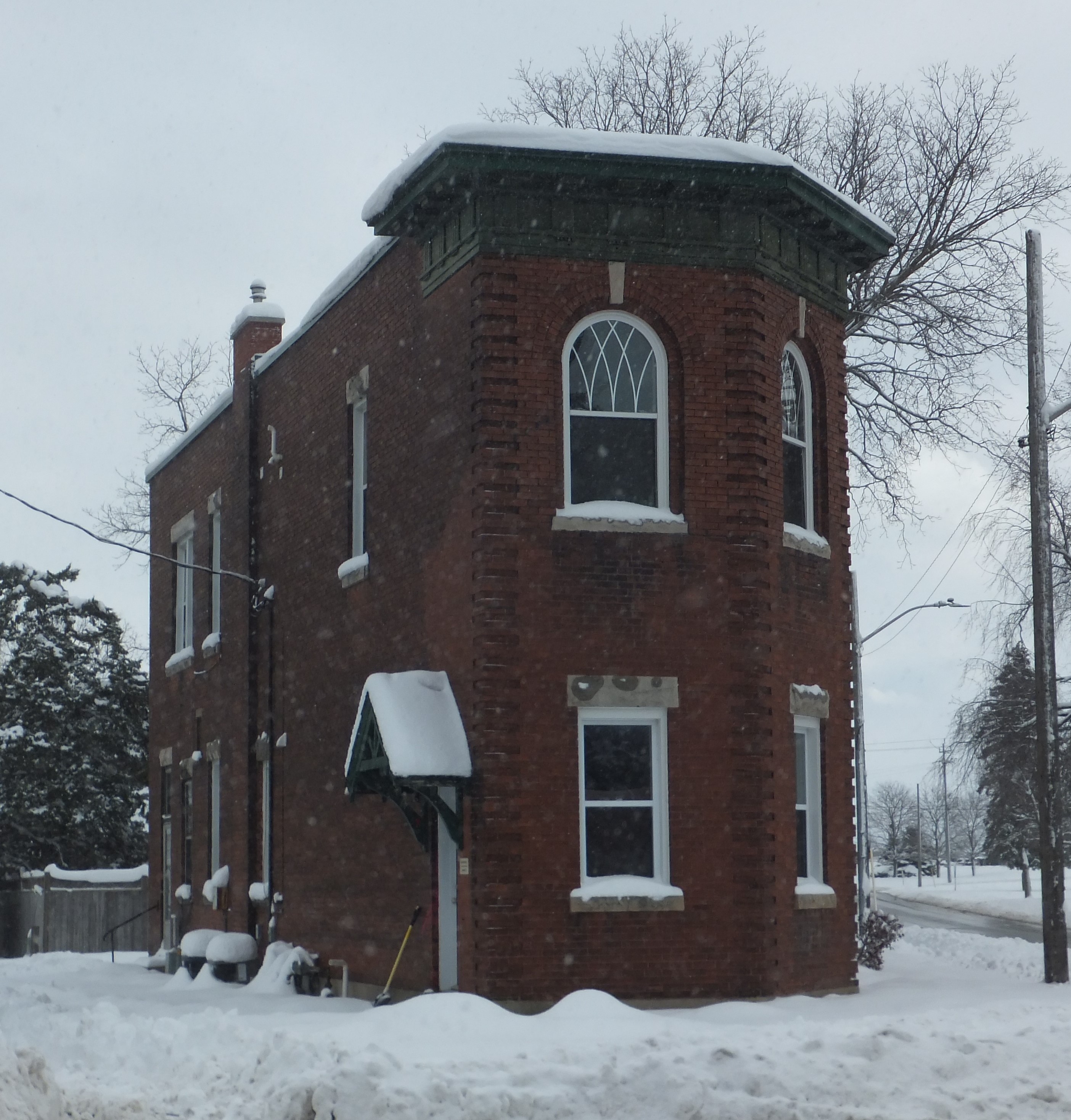 Pressed red brick flat iron Neo-classical style building