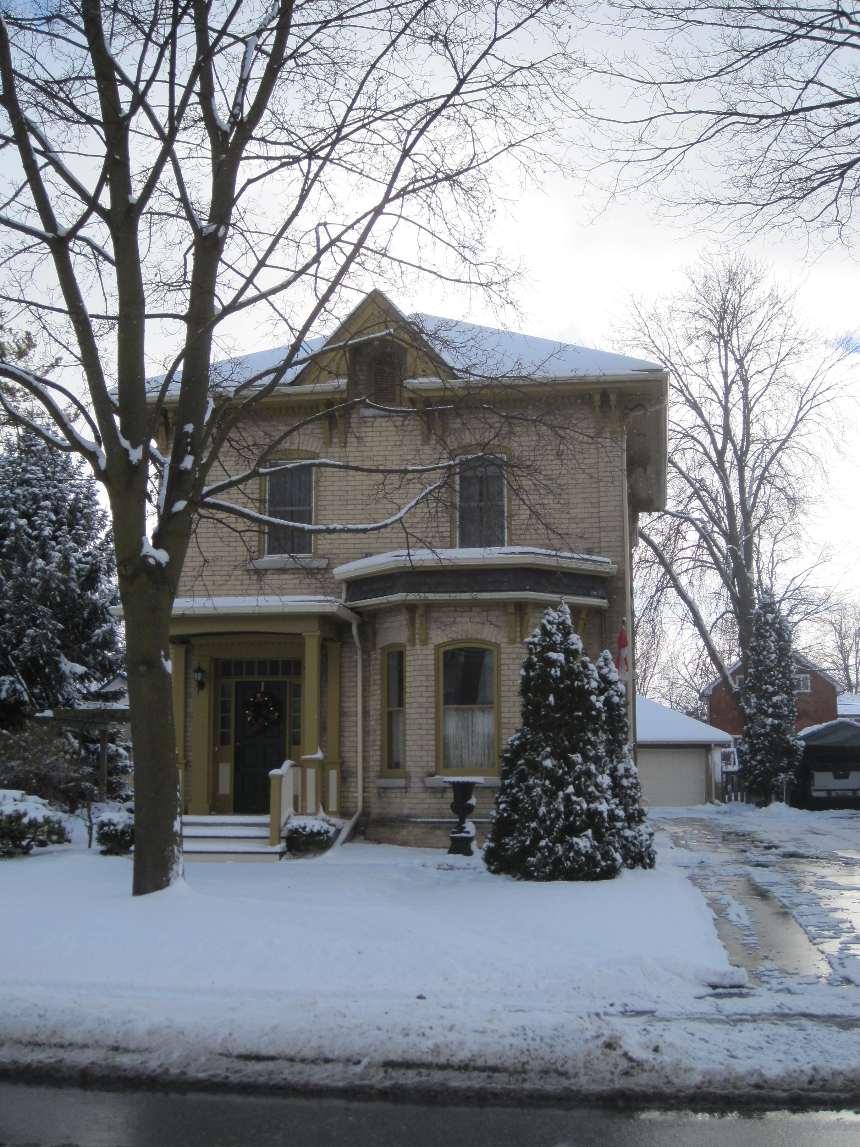 Yellow brick Italianate style house