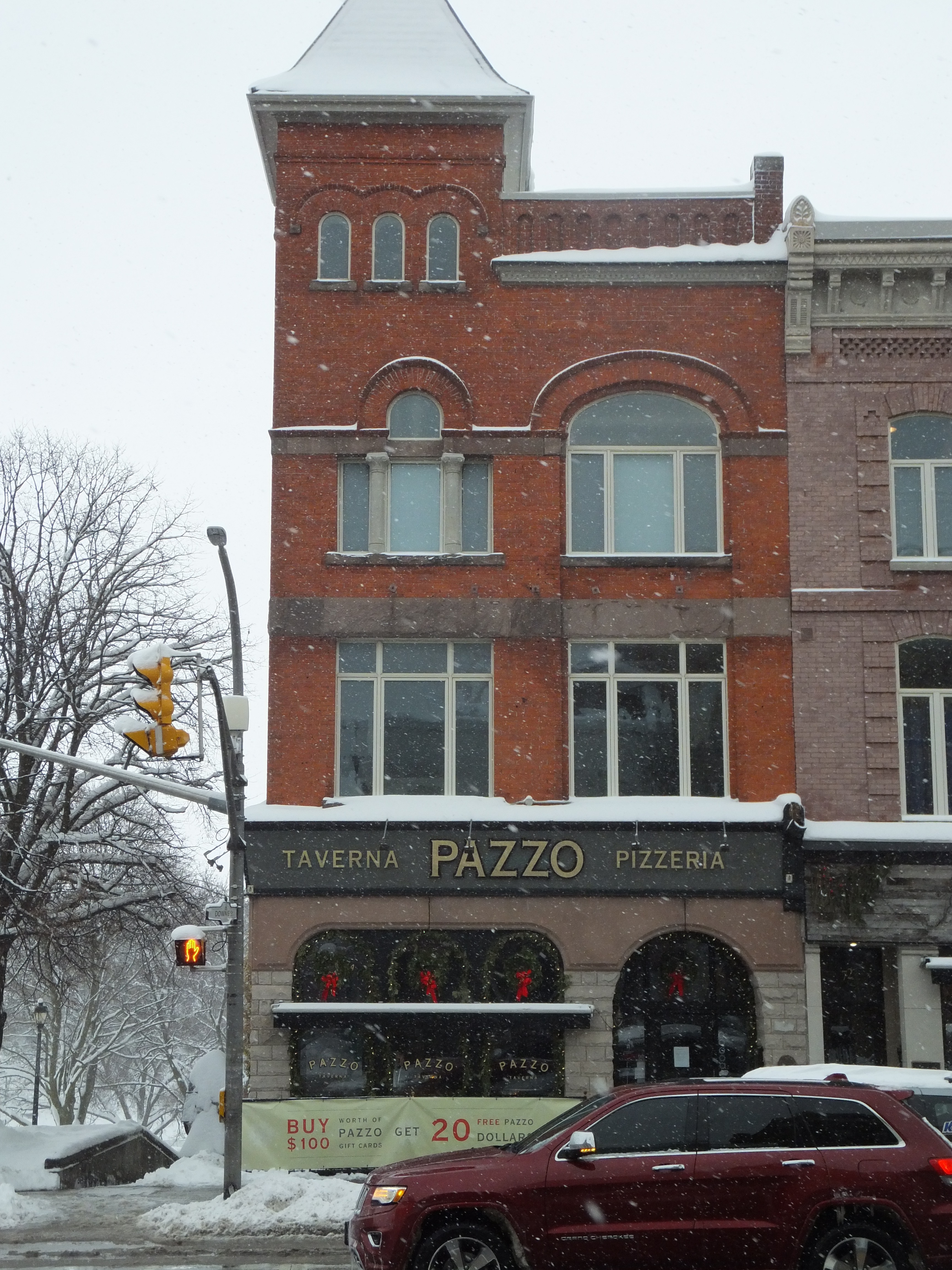 Front facade, red brick Queen Anne style three storey building