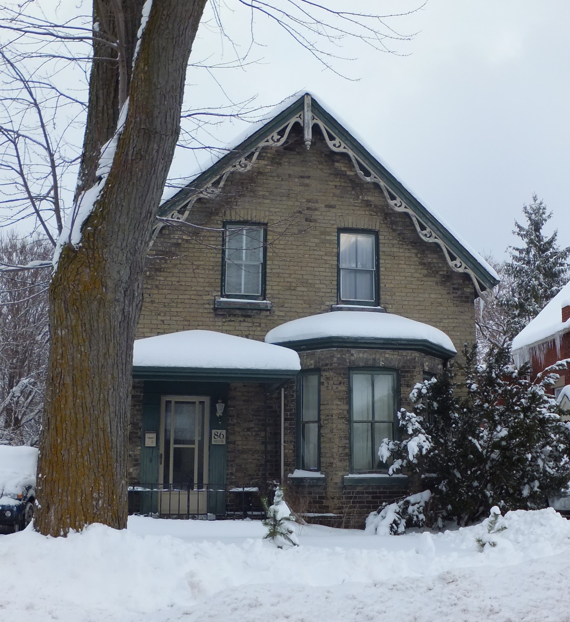 Yellow brick with ginger trim Gothic Revival style house