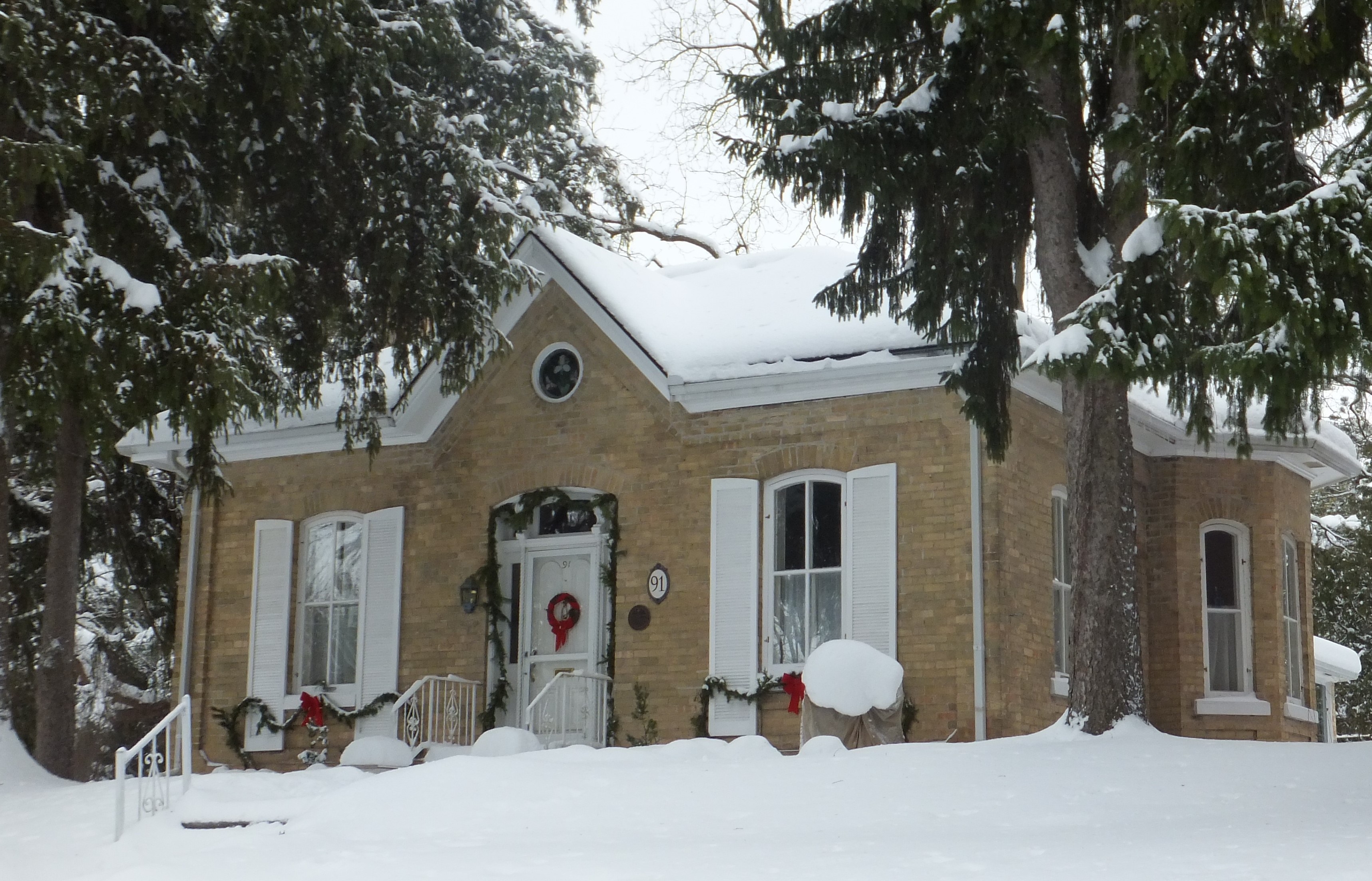 Yellow brick Ontario Cottage style house