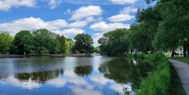 River with blue sky and white clouds above