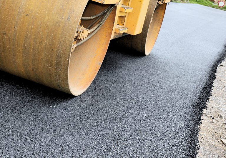 Asphalt driveway being paved